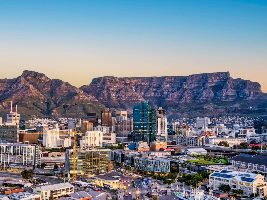 A landscape view of table mountain with the city sprawl in the foreground