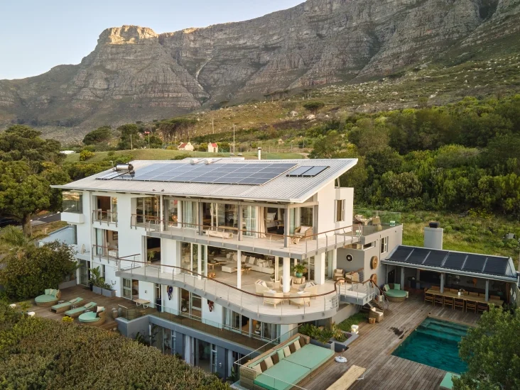 Atzaro Cape Town, a modern architectural marvel, offers breathtaking views of Table Mountain and the surrounding landscape.