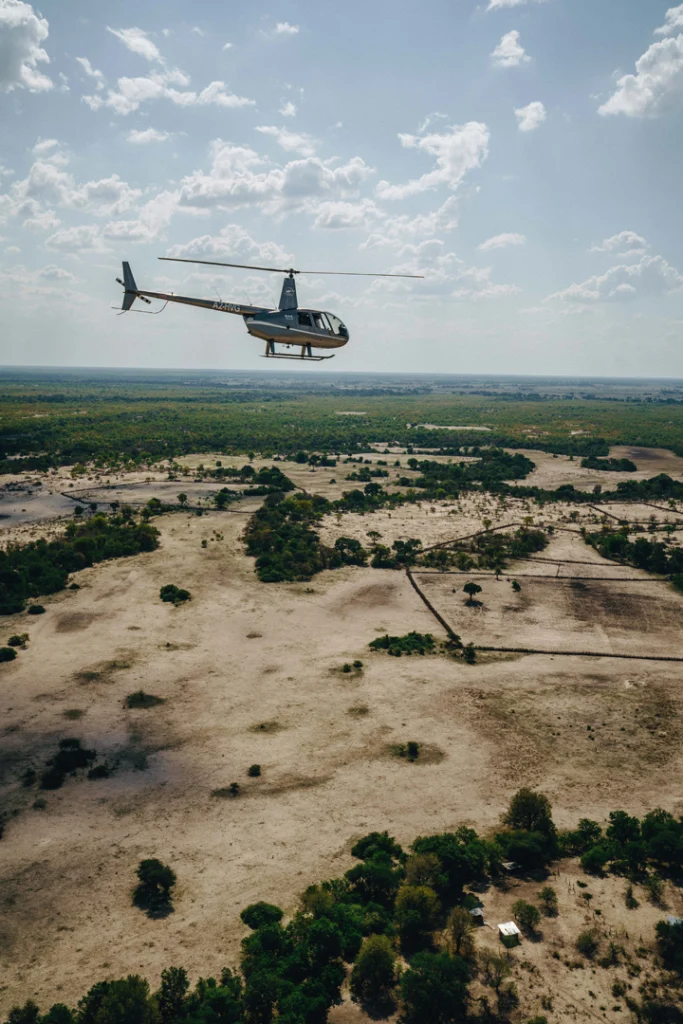 A helicopter transfer flying over a vast stretch of wilderness on a Safari from Cape Town