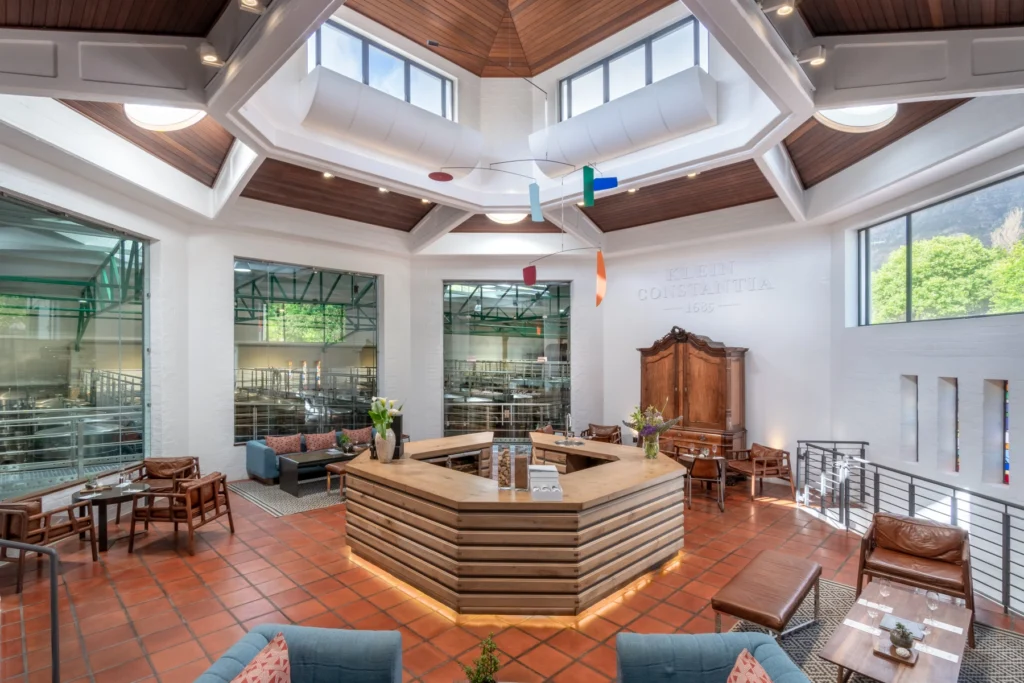 The elegant tasting room at Klein Constantia, with large windows overlooking the wine production area