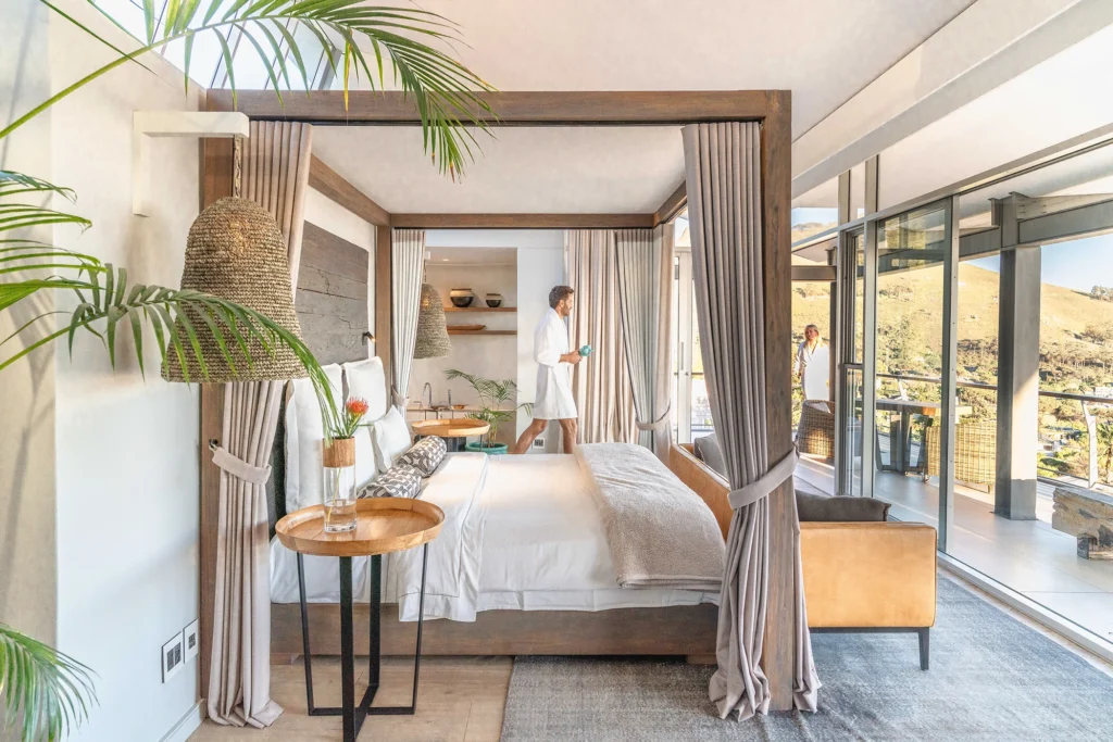 Interior of a luxury suite at Atzaró Cape Town, styled with elegant furnishings and natural tones.