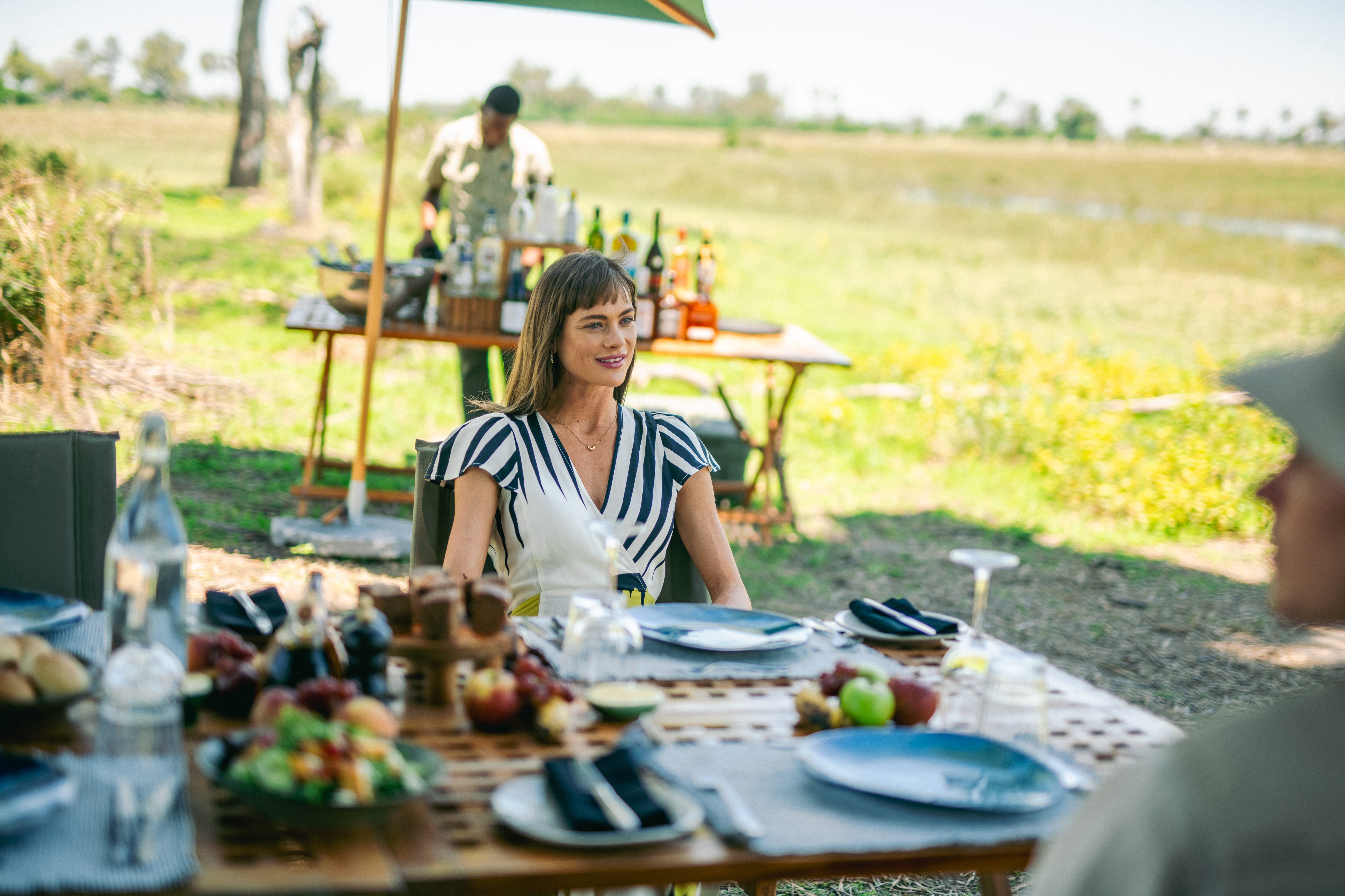 A couple having lunch in the middle of the safari in the Okavango Delta.