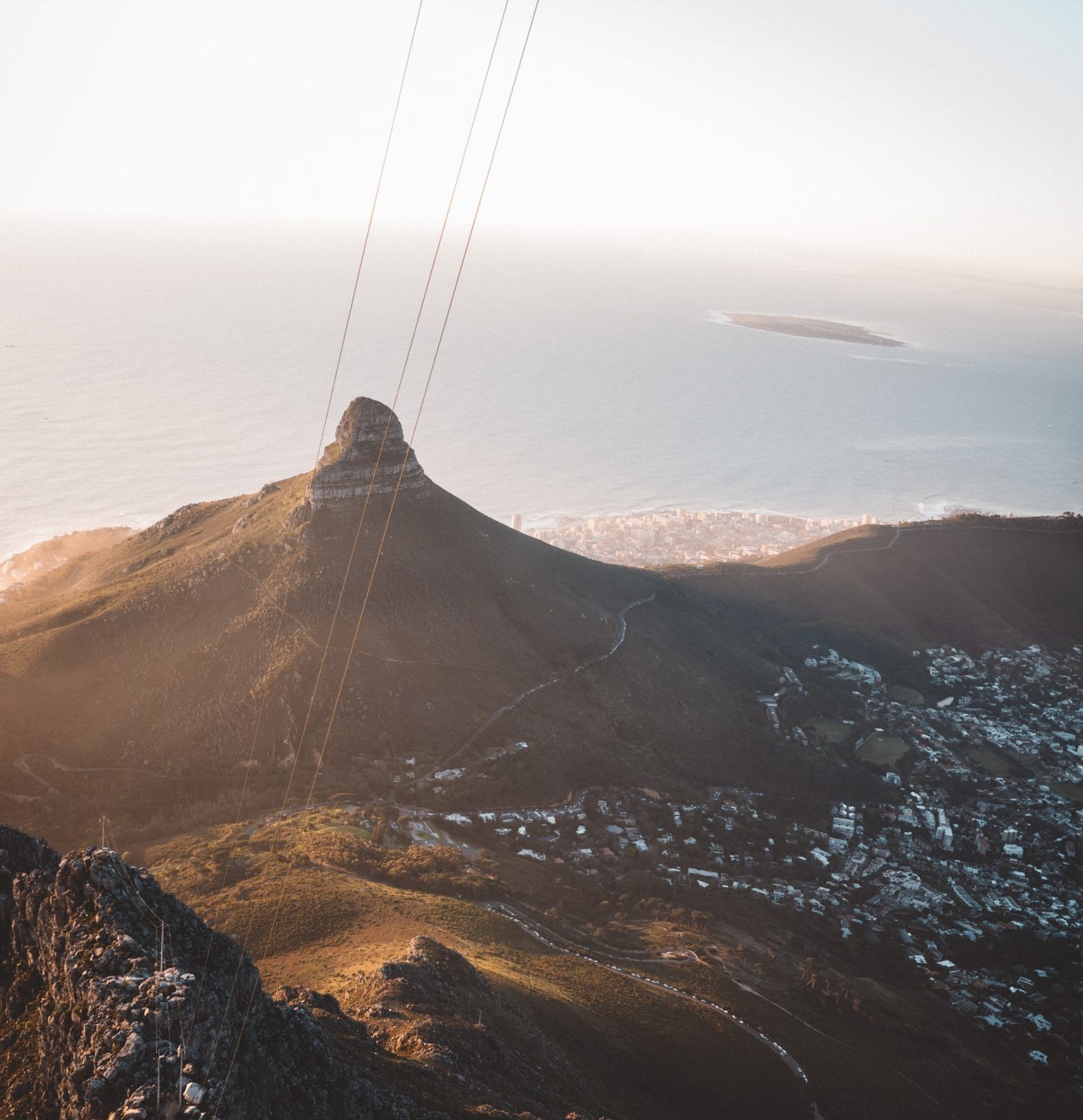 Cable car ascending Lion's Head Mountain in Cape Town.