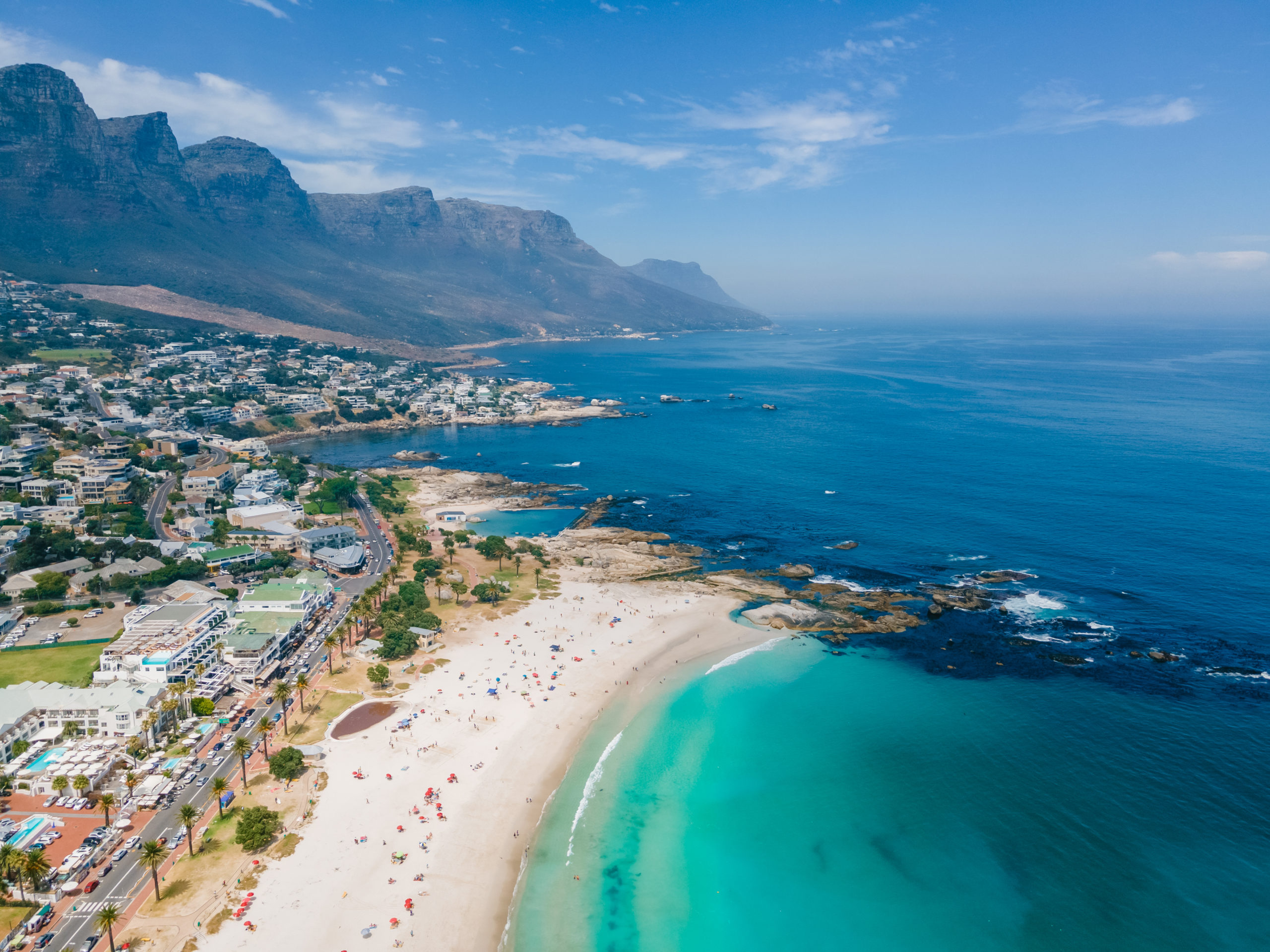 Aerial view of Camps Bay in Cape Town, with the beach, the Atlantic Ocean and the Twelve Apostles mountains